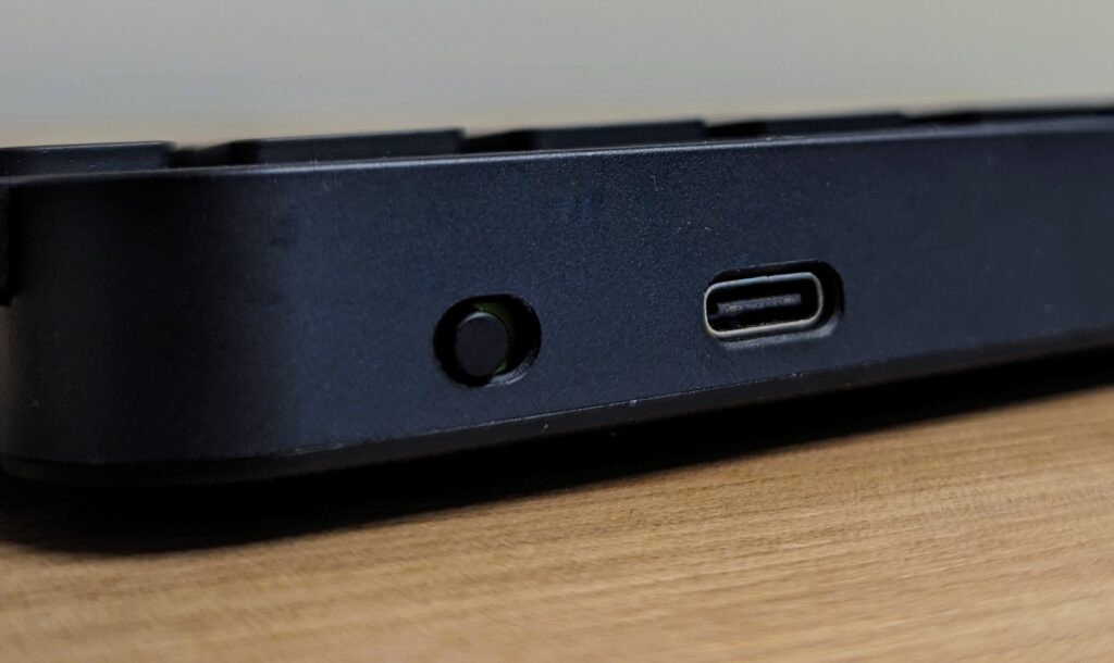 Logitech MX Keys power button and USB-C charging port.